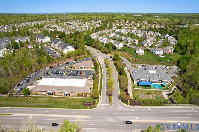 an aerial view of a house with swimming pool