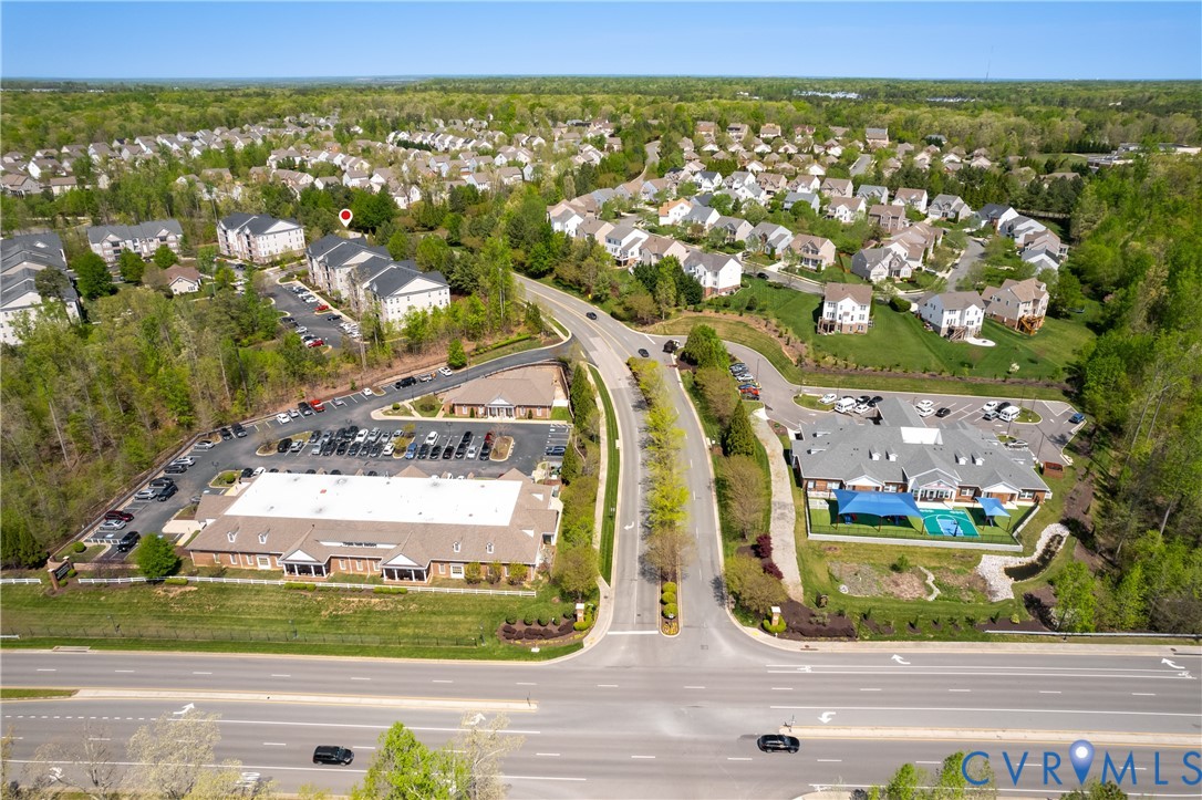 1111 Briars Court, Unit 303 Midlothian, VA 23114 - Photo 38 of 41 an aerial view of residential houses with outdoor space and street view