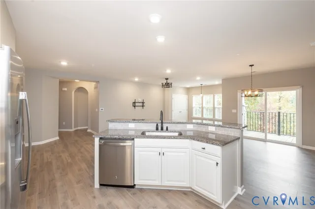 a kitchen with a sink and cabinets