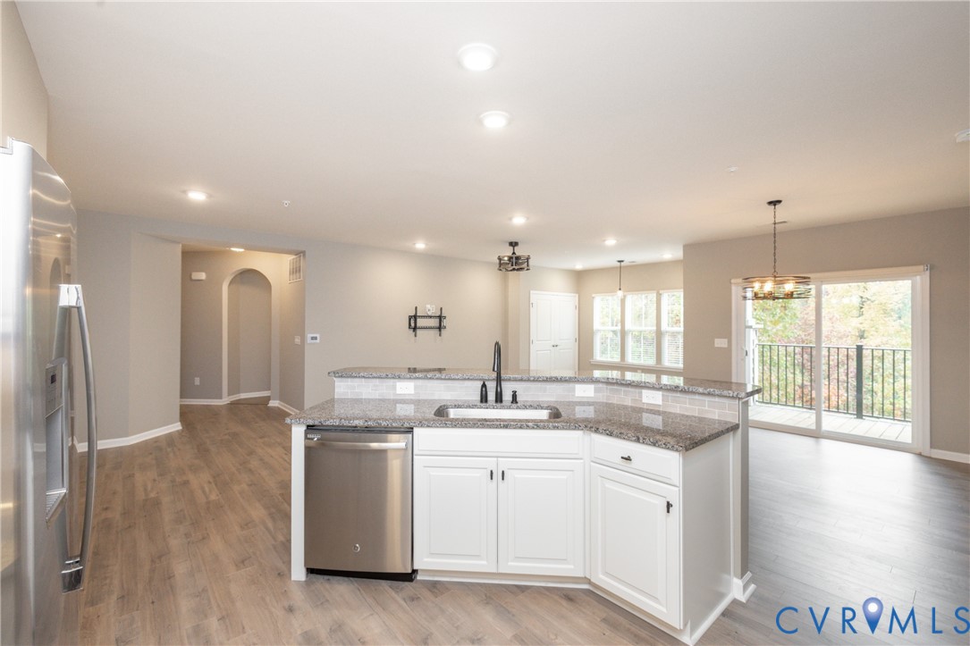 1111 Briars Court, Unit 303 Midlothian, VA 23114 - Photo 5 of 41 a kitchen with a sink and cabinets