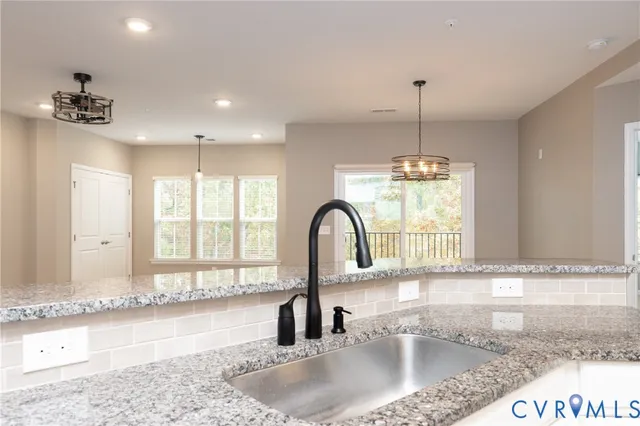 a kitchen with a sink and a window
