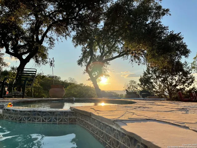 a view of a swimming pool with a patio