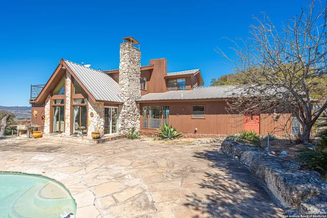 a living room with a fireplace and a window