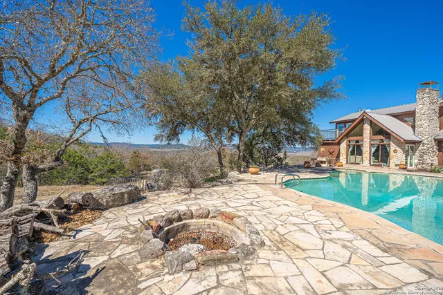 a spacious bedroom with a bed and ceiling fan