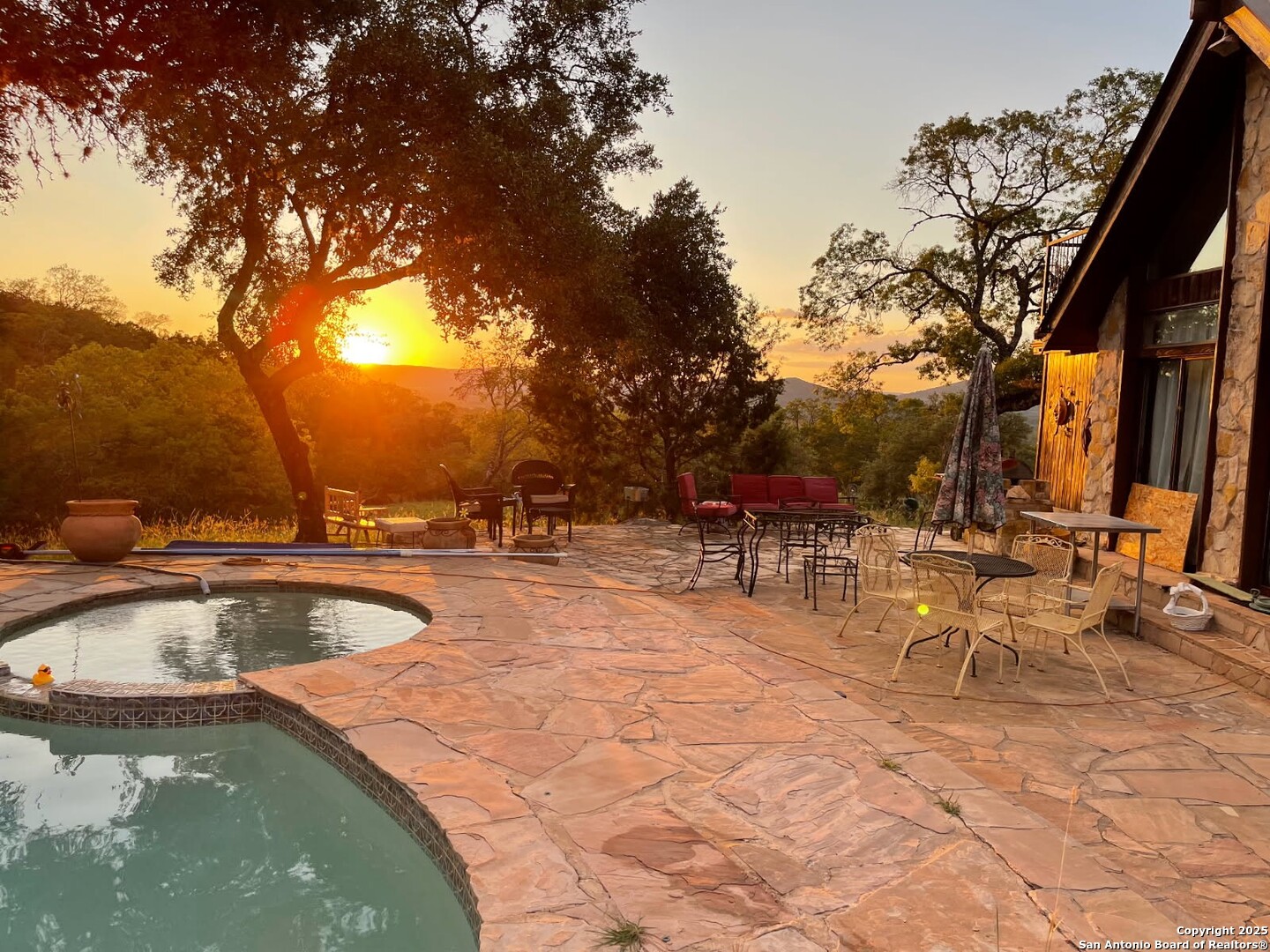 1839 Thanksgiving Road Utopia, TX 78884 - Photo 2 of 96 a view of a swimming pool with a patio