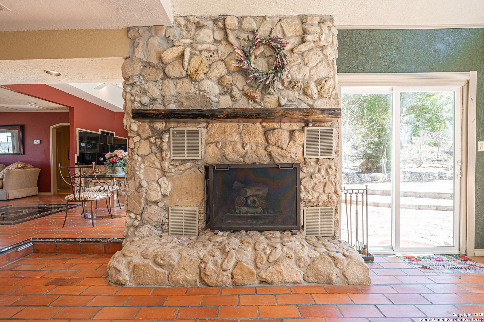 1839 Thanksgiving Road Utopia, TX 78884 - Photo 22 of 96 a living room with furniture and a fireplace
