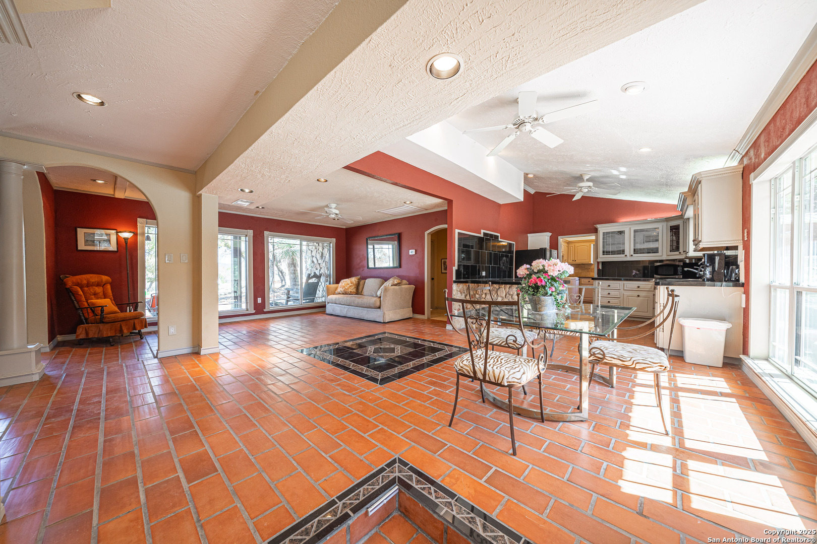 1839 Thanksgiving Road Utopia, TX 78884 - Photo 25 of 96 a view of a dining room with furniture one side kitchen view and a large window