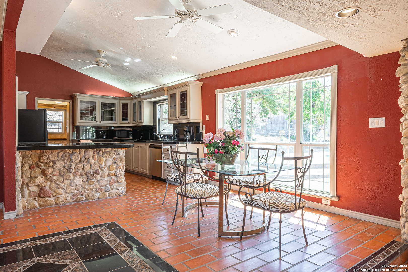 1839 Thanksgiving Road Utopia, TX 78884 - Photo 26 of 96 a view of a dining room with furniture window and wooden floor