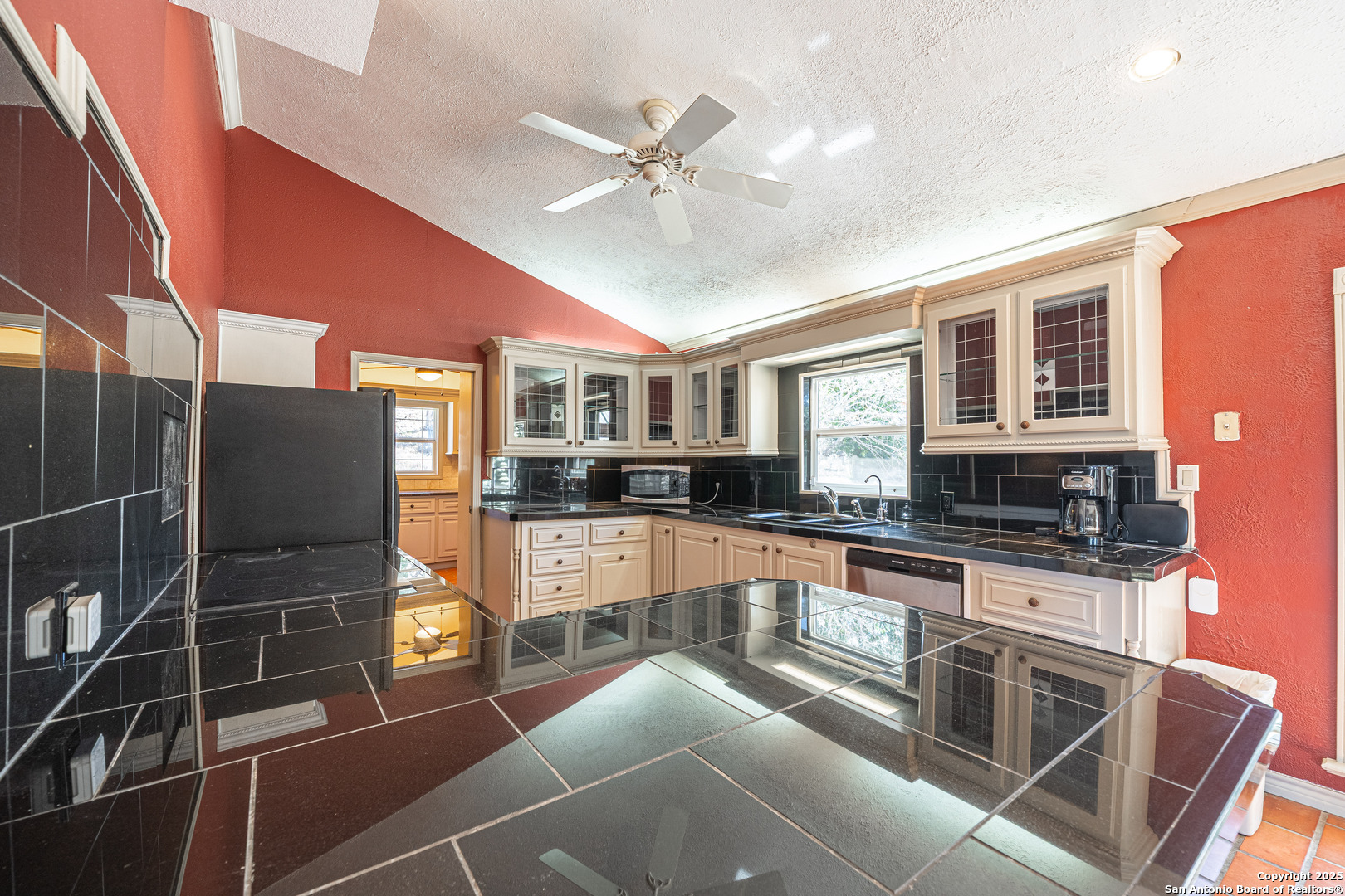 1839 Thanksgiving Road Utopia, TX 78884 - Photo 27 of 96 a kitchen with stainless steel appliances granite countertop a stove and a refrigerator