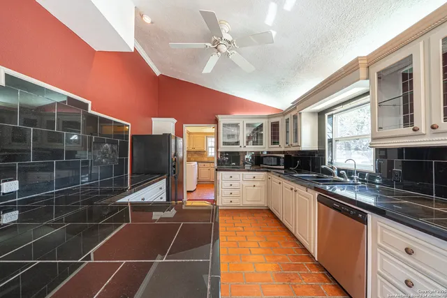 a view of a hallway with wooden floor and windows