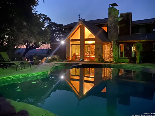 a view of a house with a swimming pool