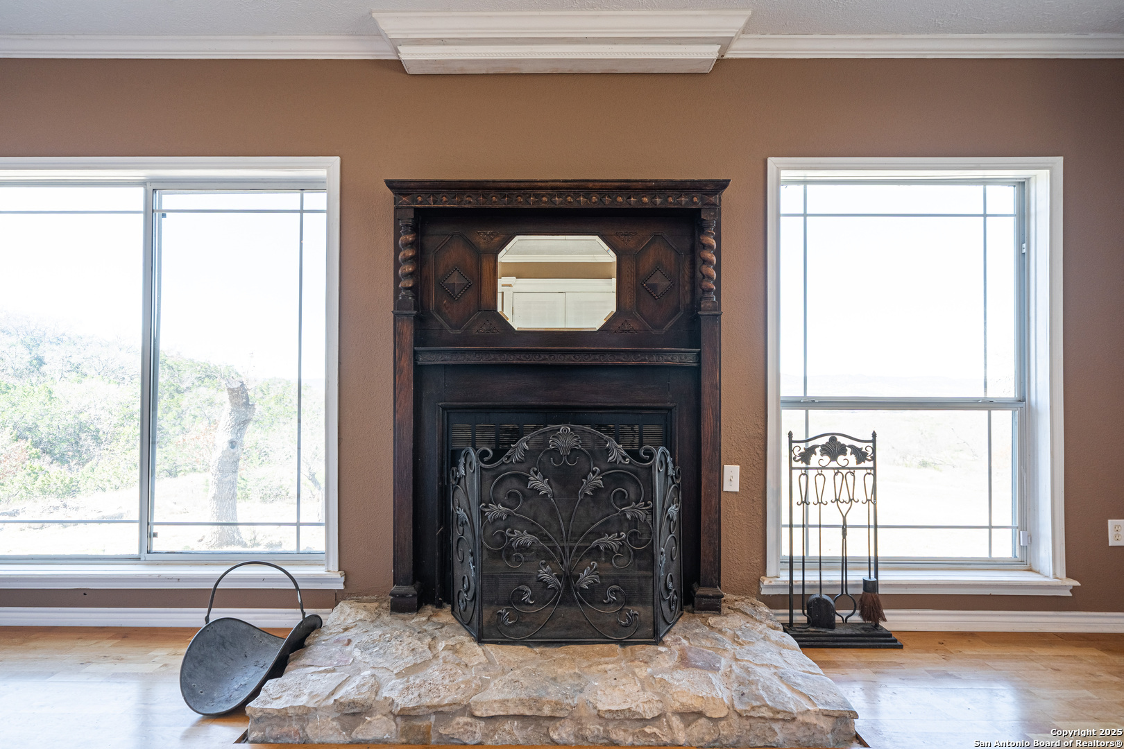 1839 Thanksgiving Road Utopia, TX 78884 - Photo 32 of 96 a living room with a fireplace and a window