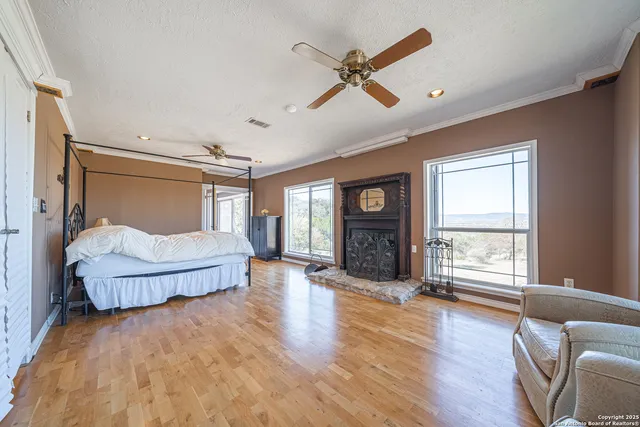 a front view of house with yard and trees in the background