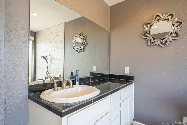 a view of a boat in the backyard of a house