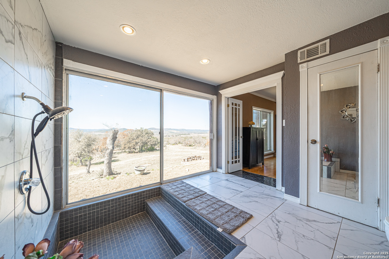 1839 Thanksgiving Road Utopia, TX 78884 - Photo 38 of 96 a view of a room with large windows