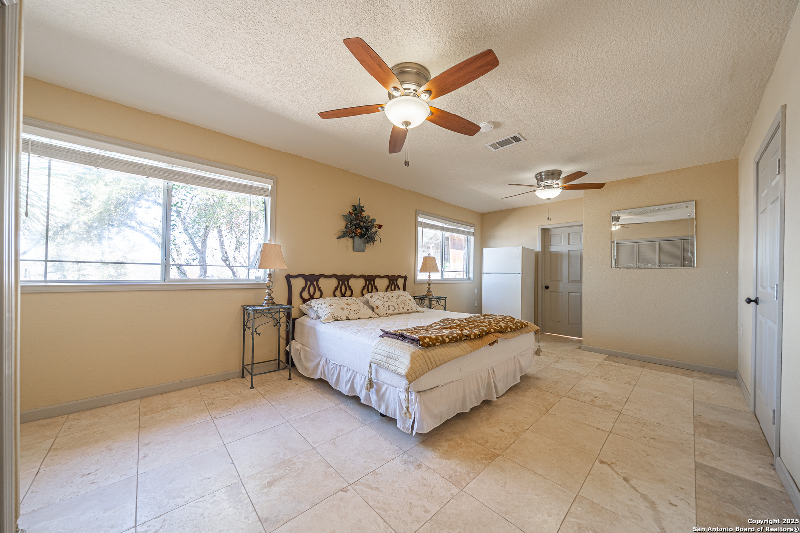 1839 Thanksgiving Road Utopia, TX 78884 - Photo 42 of 96 a spacious bedroom with a bed and window