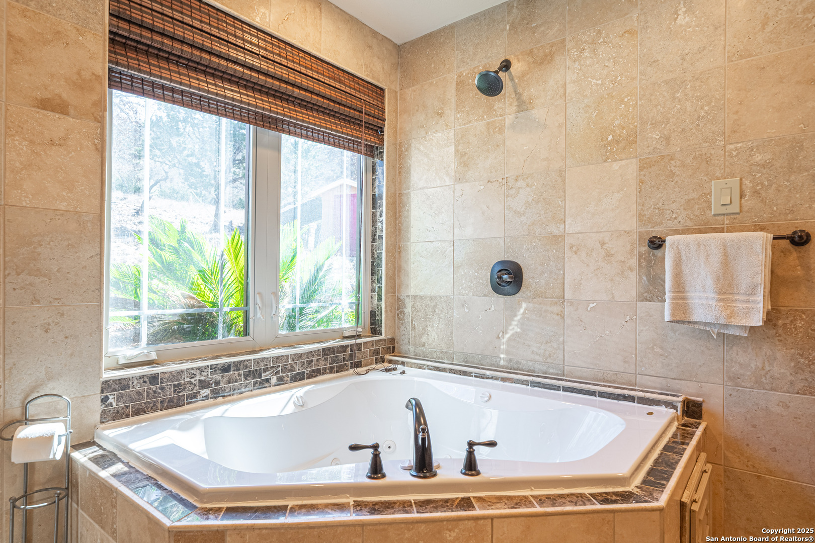 1839 Thanksgiving Road Utopia, TX 78884 - Photo 43 of 96 a white bath tub sitting in a bathroom next to a window