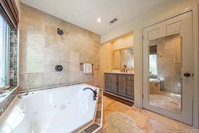 a view of a dry yard with mountains and green space