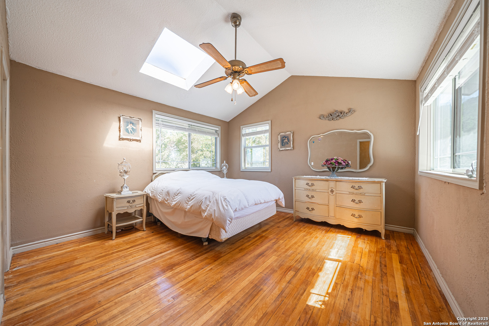 1839 Thanksgiving Road Utopia, TX 78884 - Photo 50 of 96 a bedroom with a bed and wooden floor