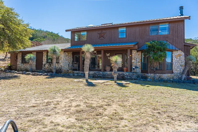 a view of a livingroom with furniture and a flat screen tv