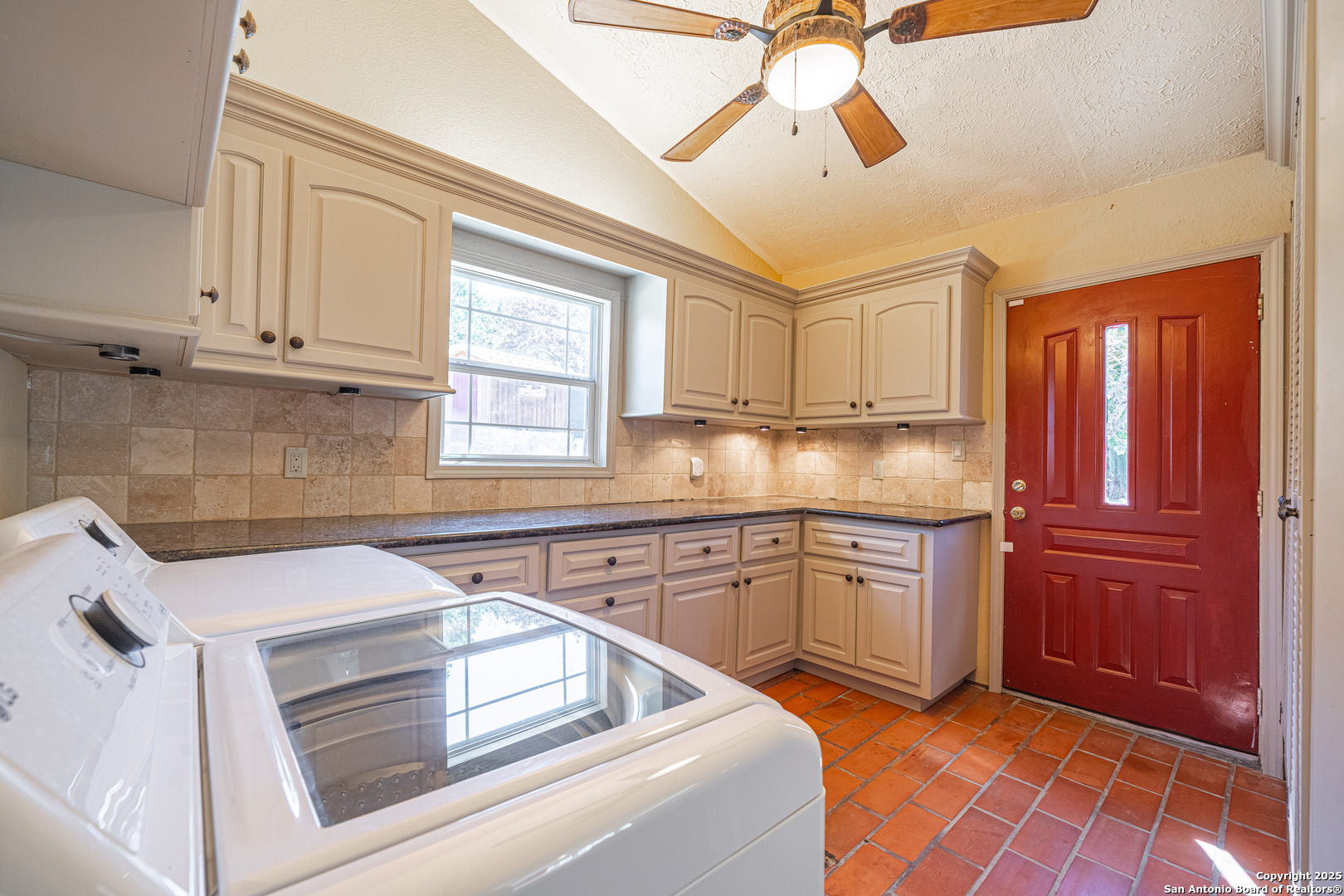 1839 Thanksgiving Road Utopia, TX 78884 - Photo 58 of 96 a kitchen with stainless steel appliances granite countertop a sink and cabinets
