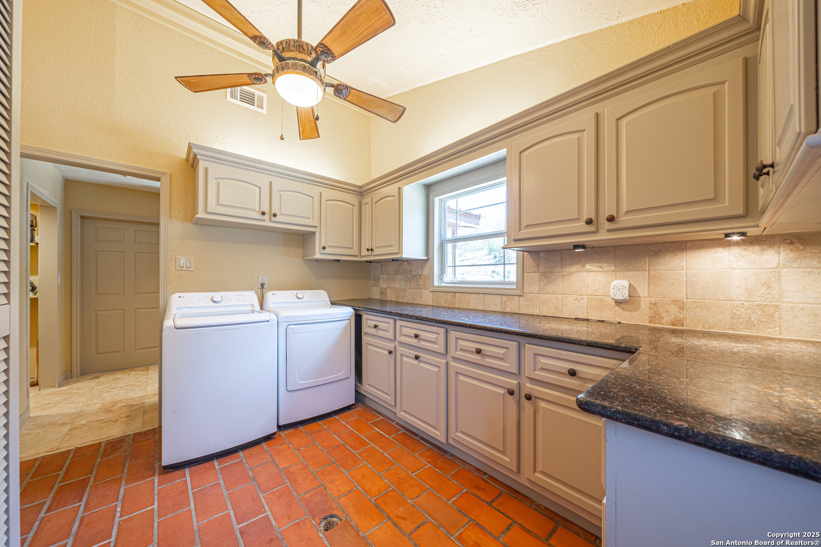 1839 Thanksgiving Road Utopia, TX 78884 - Photo 59 of 96 a kitchen with a sink cabinets and window