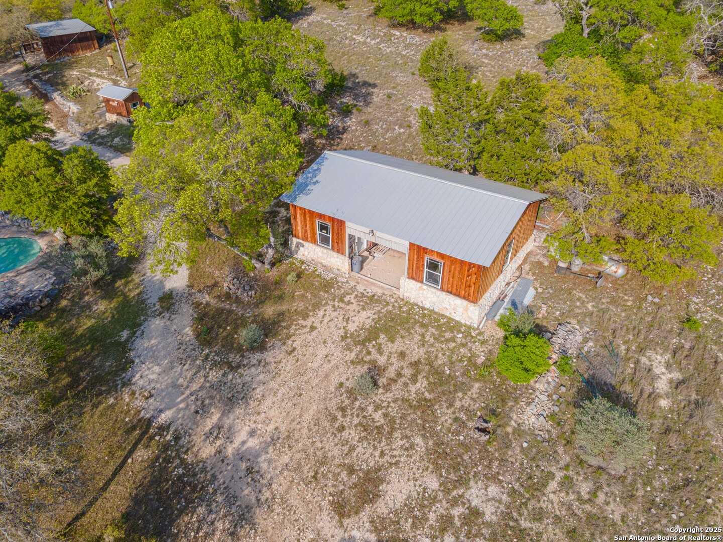 1839 Thanksgiving Road Utopia, TX 78884 - Photo 66 of 96 an aerial view of a house with a yard and large tree