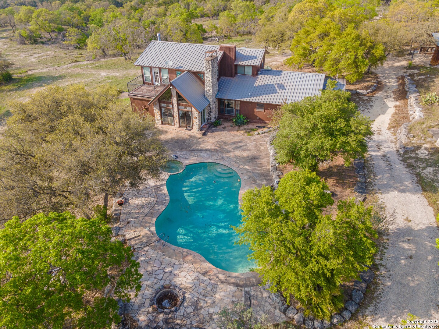 1839 Thanksgiving Road Utopia, TX 78884 - Photo 68 of 96 an aerial view of a house with a yard basket ball court and outdoor seating