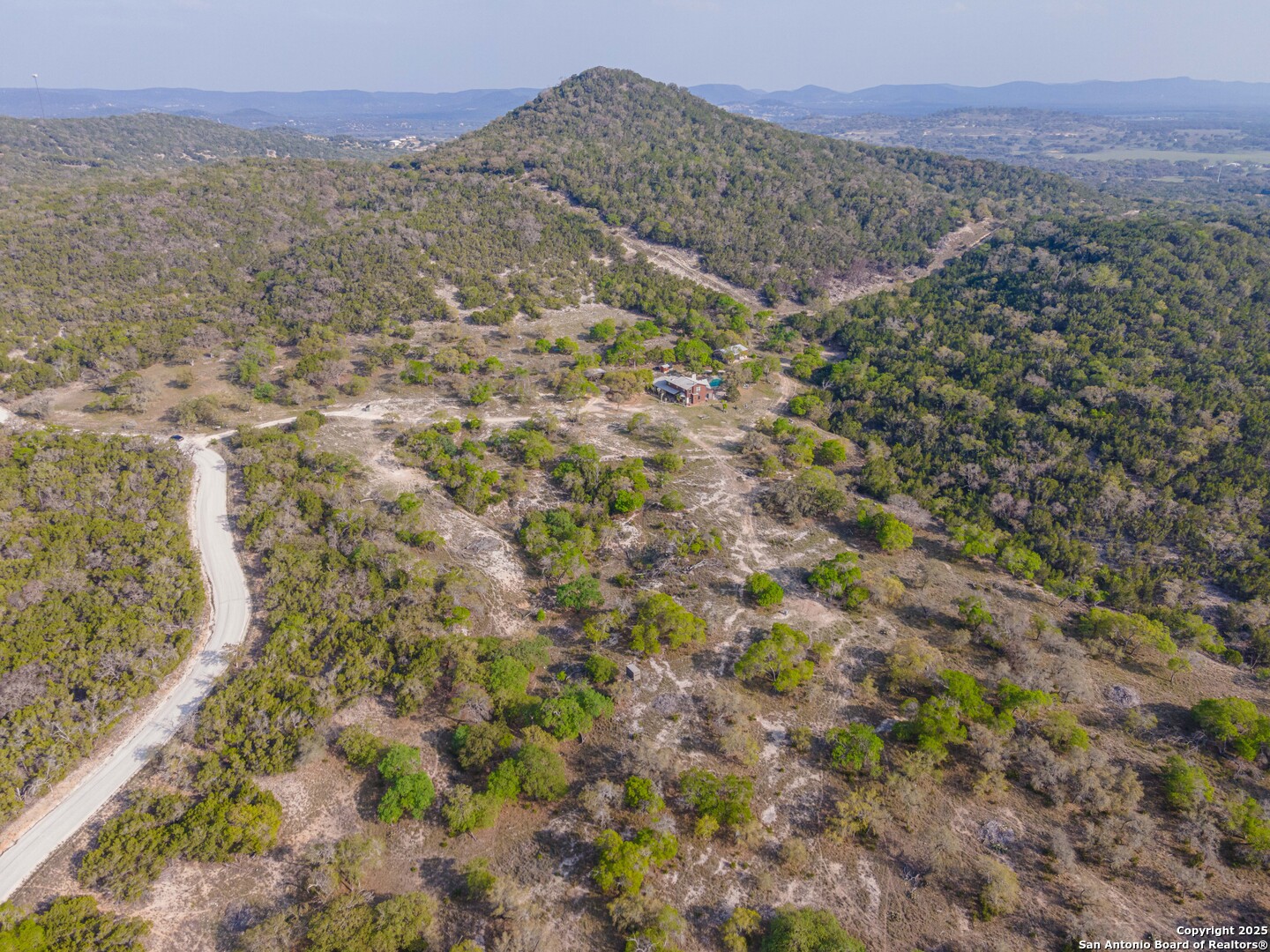 1839 Thanksgiving Road Utopia, TX 78884 - Photo 88 of 96 a view of a dry yard with mountains and green space