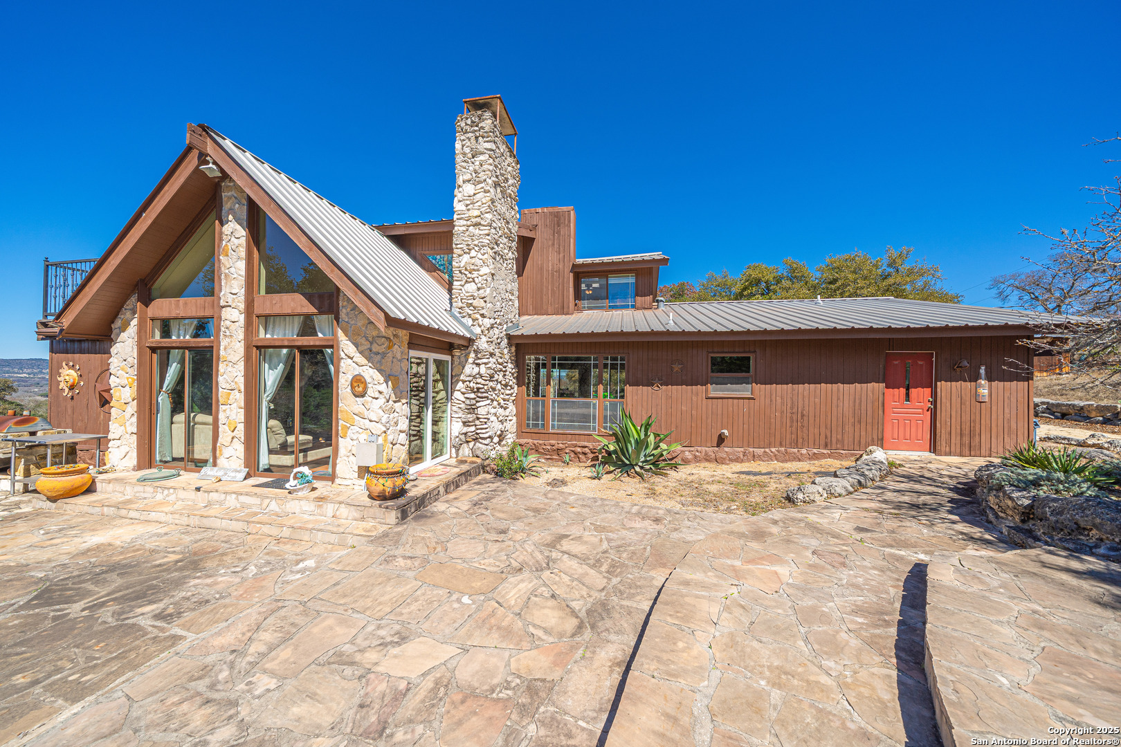 1839 Thanksgiving Road Utopia, TX 78884 - Photo 9 of 96 a front view of a house with a patio
