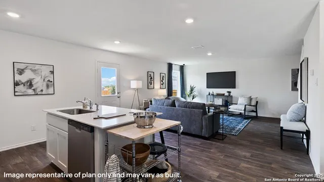 a view of a livingroom with furniture and a flat screen tv