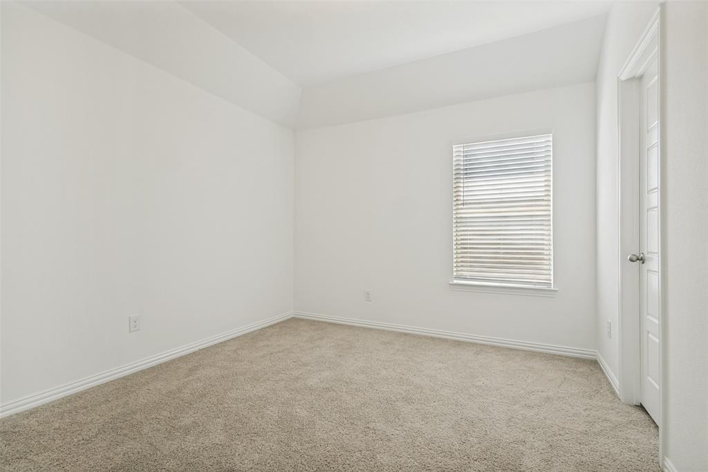 1448 Sun Gdn Way Justin, TX 76247 - Photo 12 of 15 Carpeted room featuring a single window with blinds, white trim, and a white paneled door