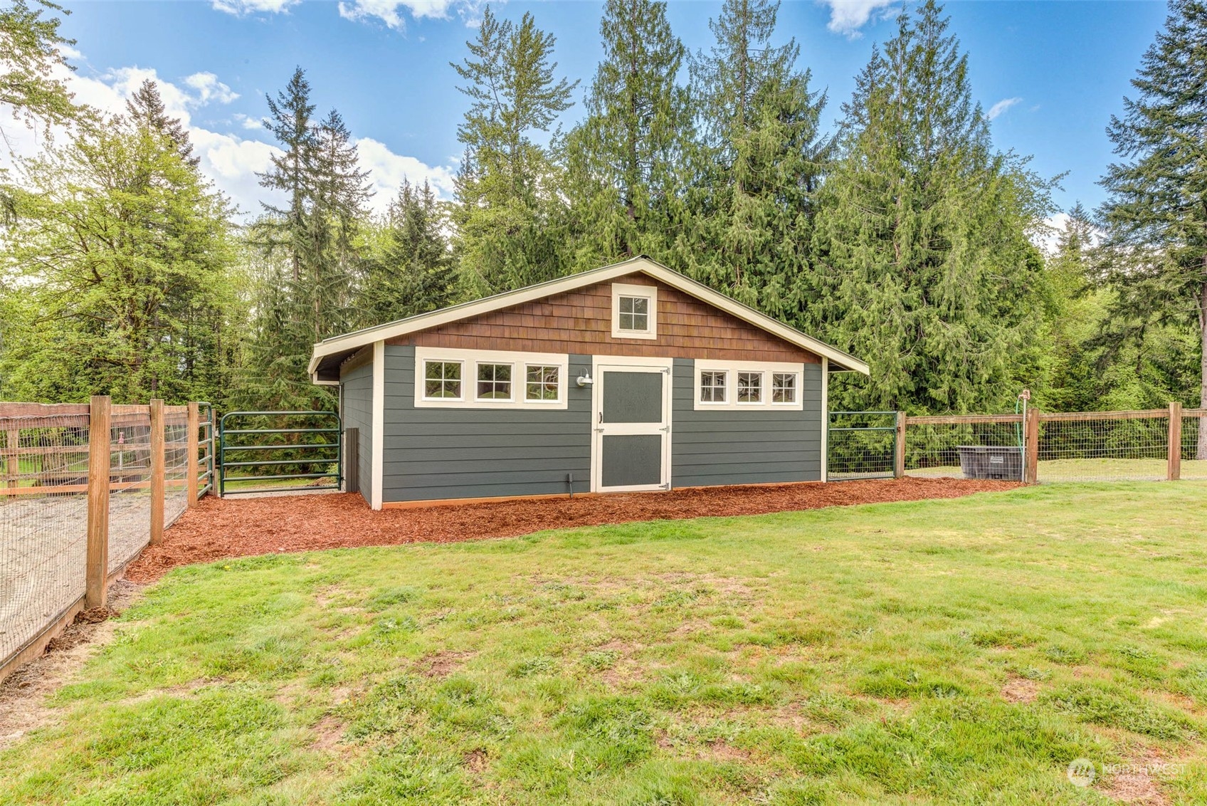 11821 Wagner Road Monroe, WA 98272 - Photo 15 of 40 a view of a house with a yard and garage