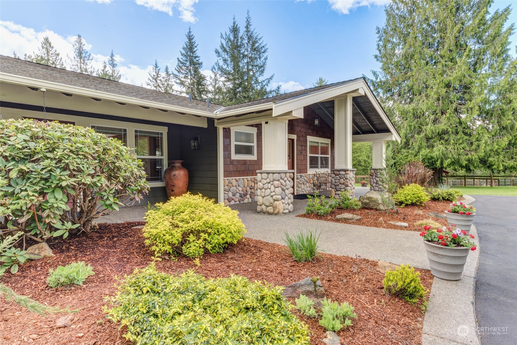 11821 Wagner Road Monroe, WA 98272 - Photo 16 of 40 a front view of a house with a yard and potted plants