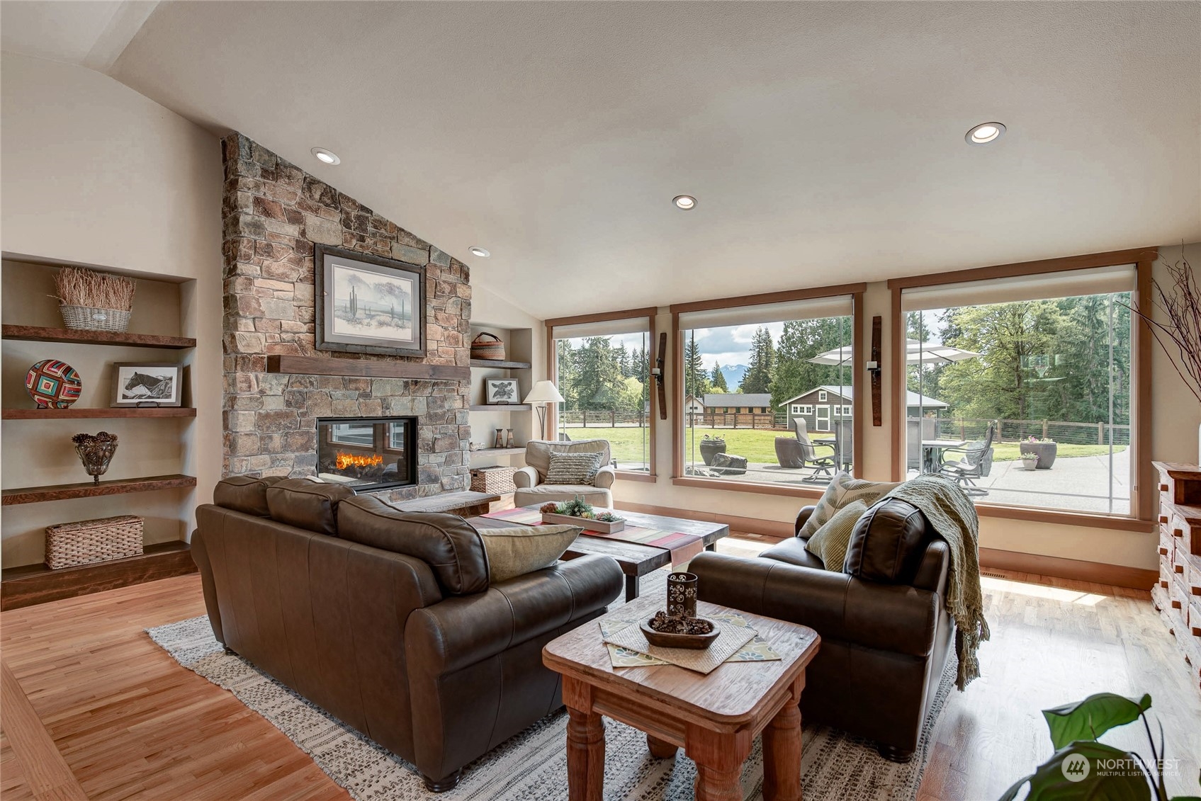 11821 Wagner Road Monroe, WA 98272 - Photo 17 of 40 a living room with furniture large window and a fireplace