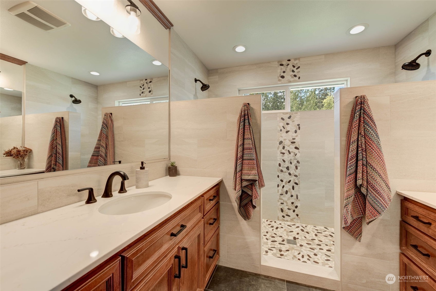 11821 Wagner Road Monroe, WA 98272 - Photo 24 of 40 a bathroom with a double vanity sink and a mirror