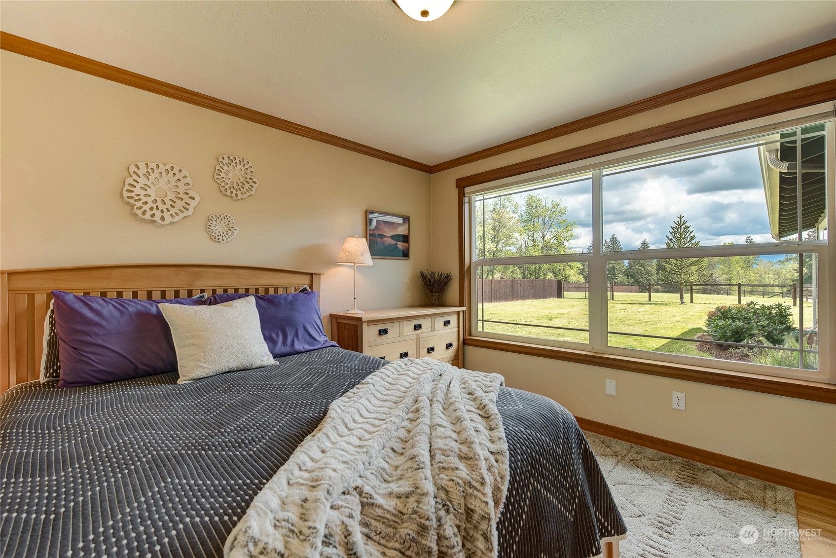 11821 Wagner Road Monroe, WA 98272 - Photo 26 of 40 a bed sitting in a bedroom next to a window