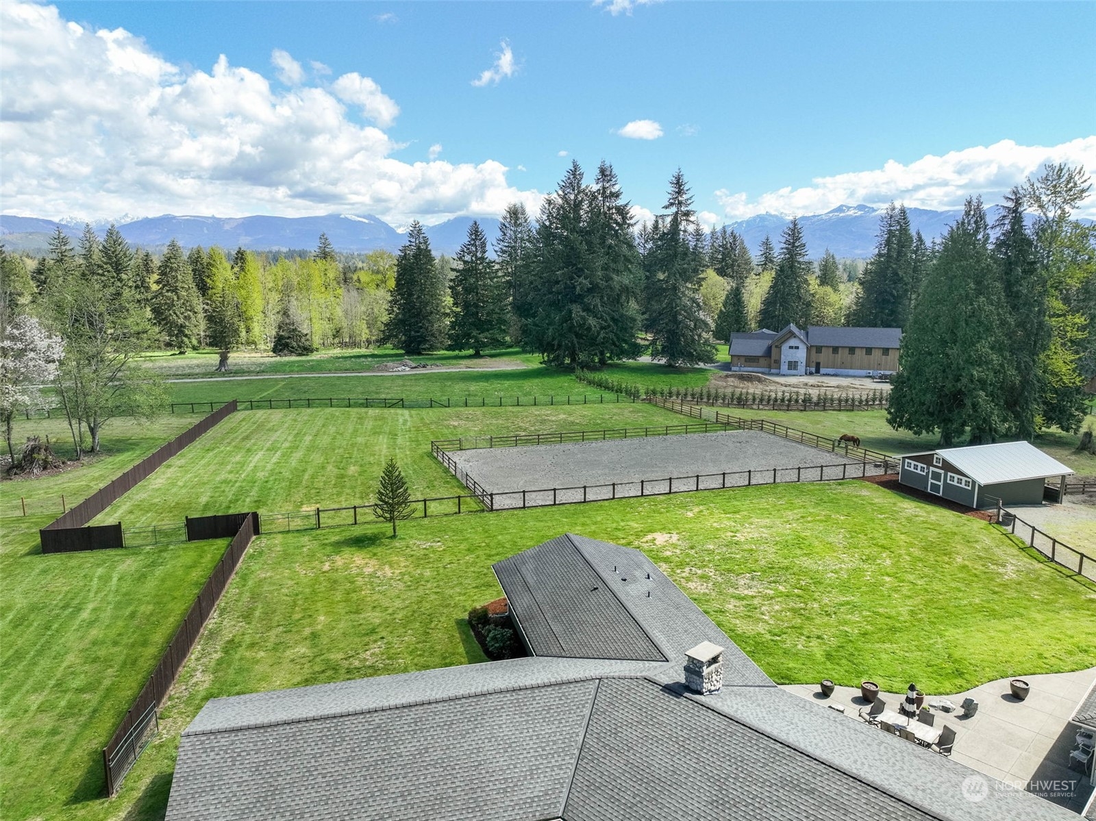 11821 Wagner Road Monroe, WA 98272 - Photo 3 of 40 a view of a swimming pool with a yard and outdoor seating
