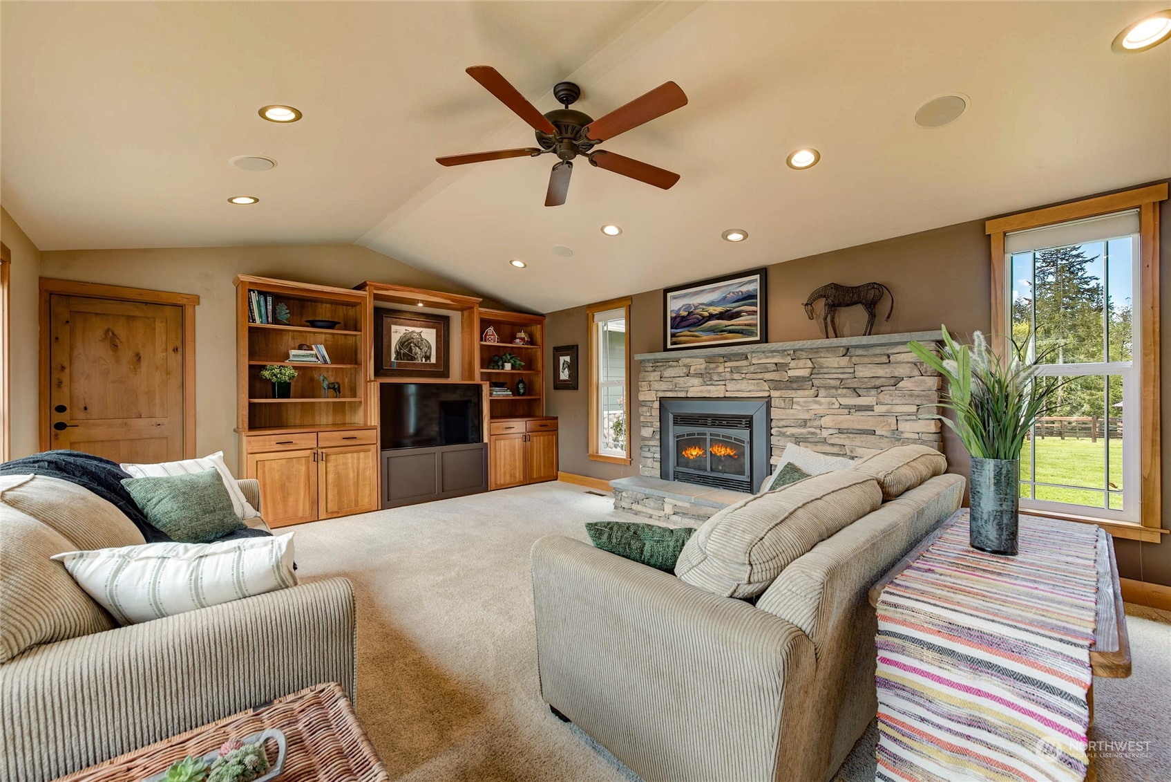 11821 Wagner Road Monroe, WA 98272 - Photo 34 of 40 a living room with furniture and a fireplace