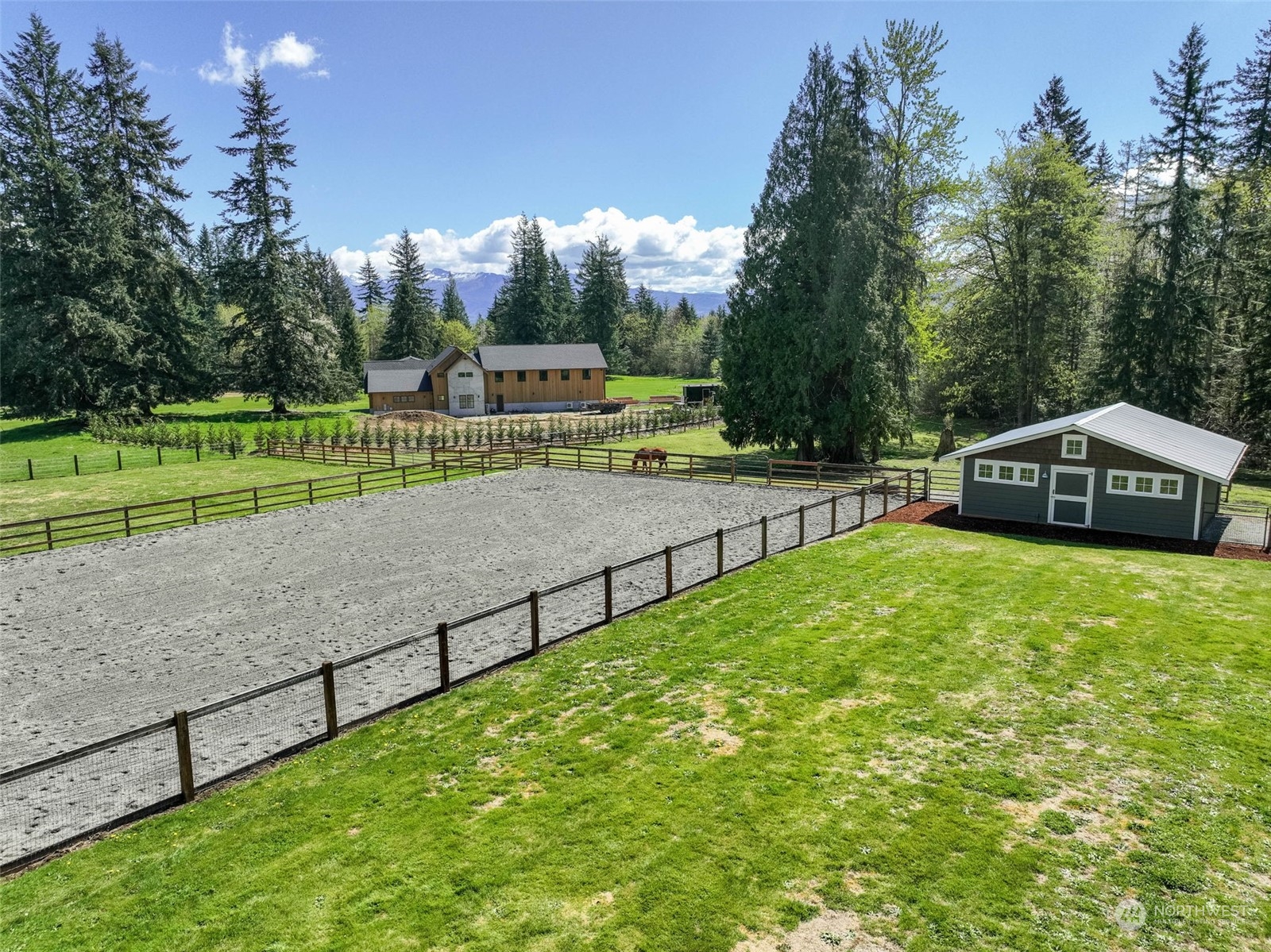 11821 Wagner Road Monroe, WA 98272 - Photo 4 of 40 a view of a green field with trees in the background