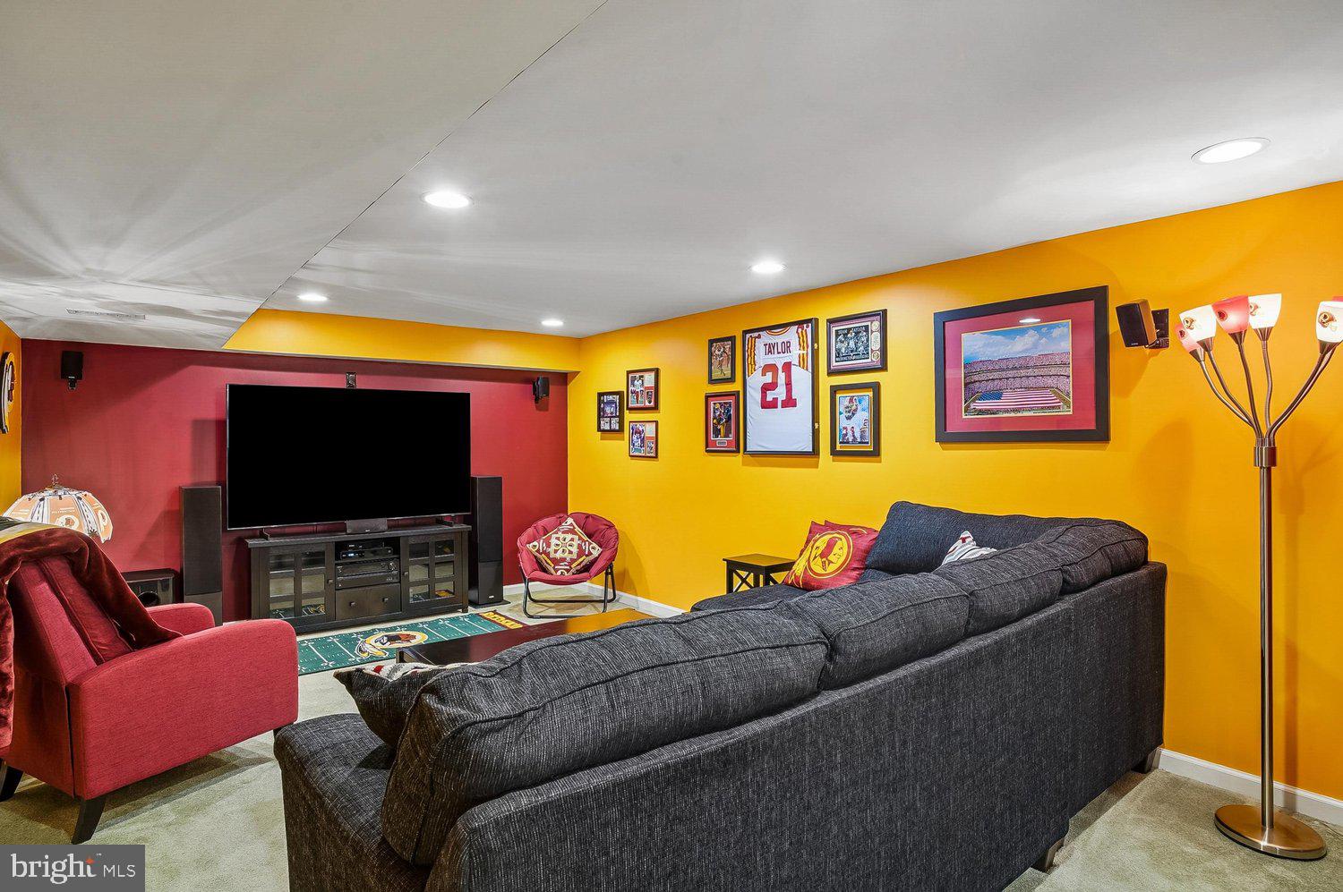 217 Raccoon Run Court Hanover, MD 21076 - Photo 27 of 38 a living room with furniture and a flat screen tv