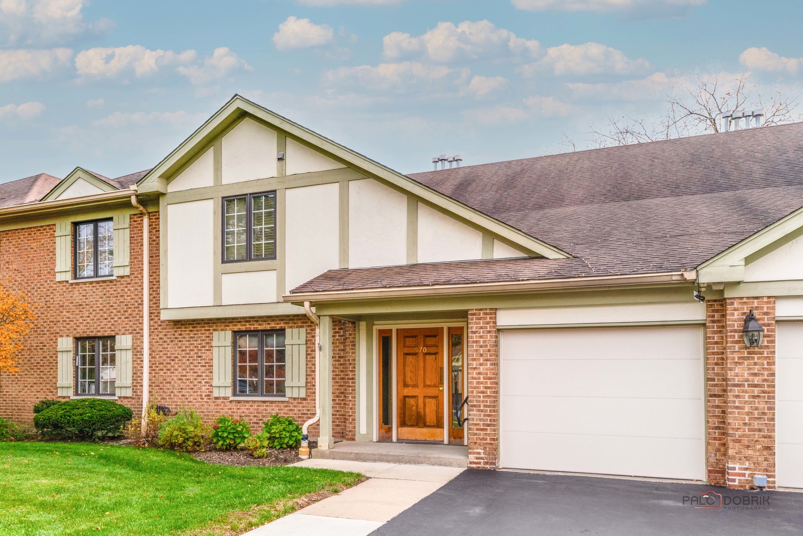 970 Ivy Lane, Unit C Deerfield, IL 60015 - Photo 1 of 36 a view of a white house next to a yard