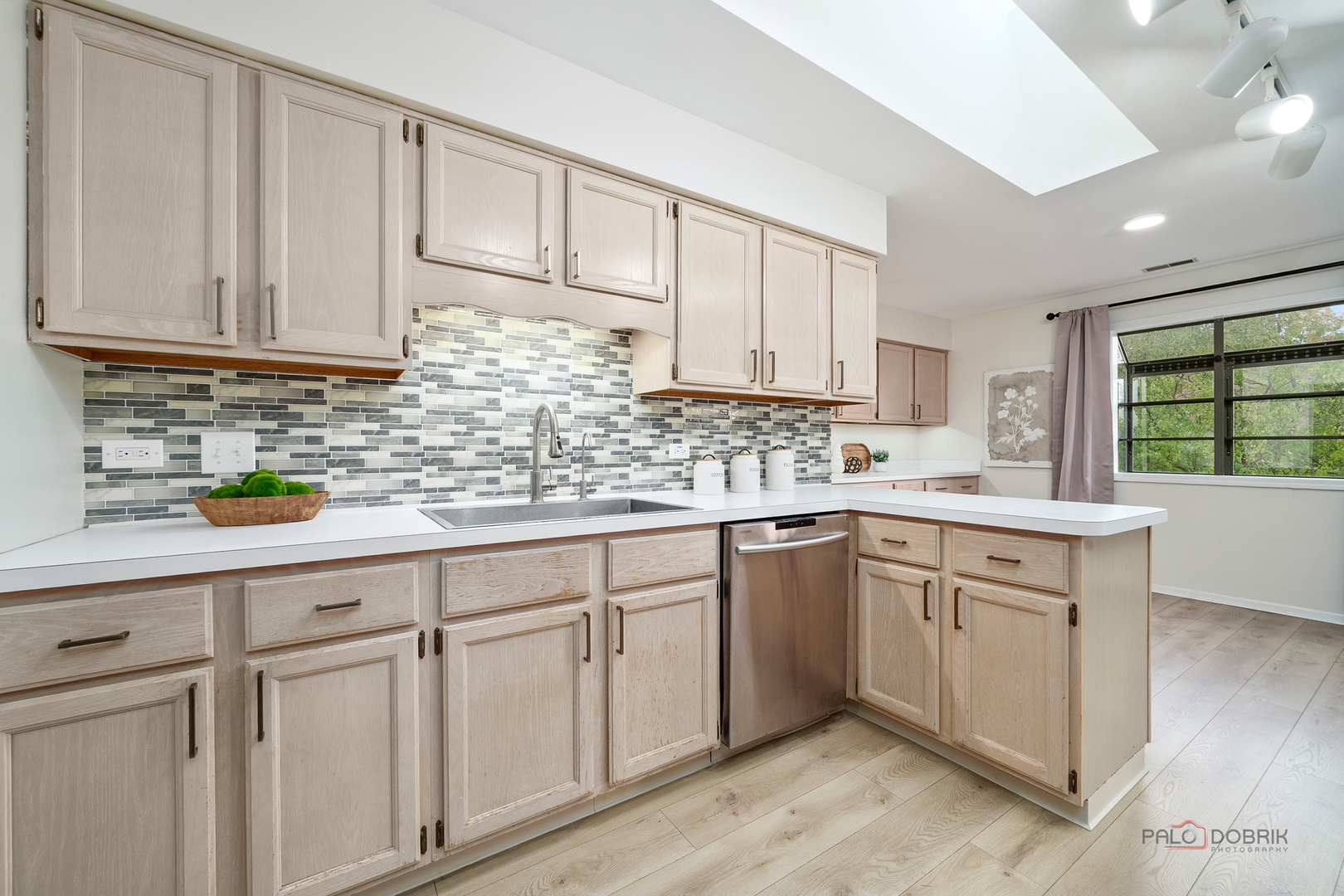 970 Ivy Lane, Unit C Deerfield, IL 60015 - Photo 16 of 36 a kitchen with white cabinets sink and window