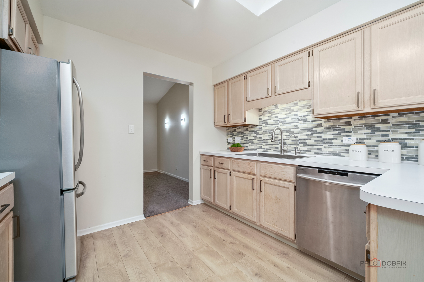 970 Ivy Lane, Unit C Deerfield, IL 60015 - Photo 17 of 36 a kitchen with stainless steel appliances granite countertop white cabinets and refrigerator