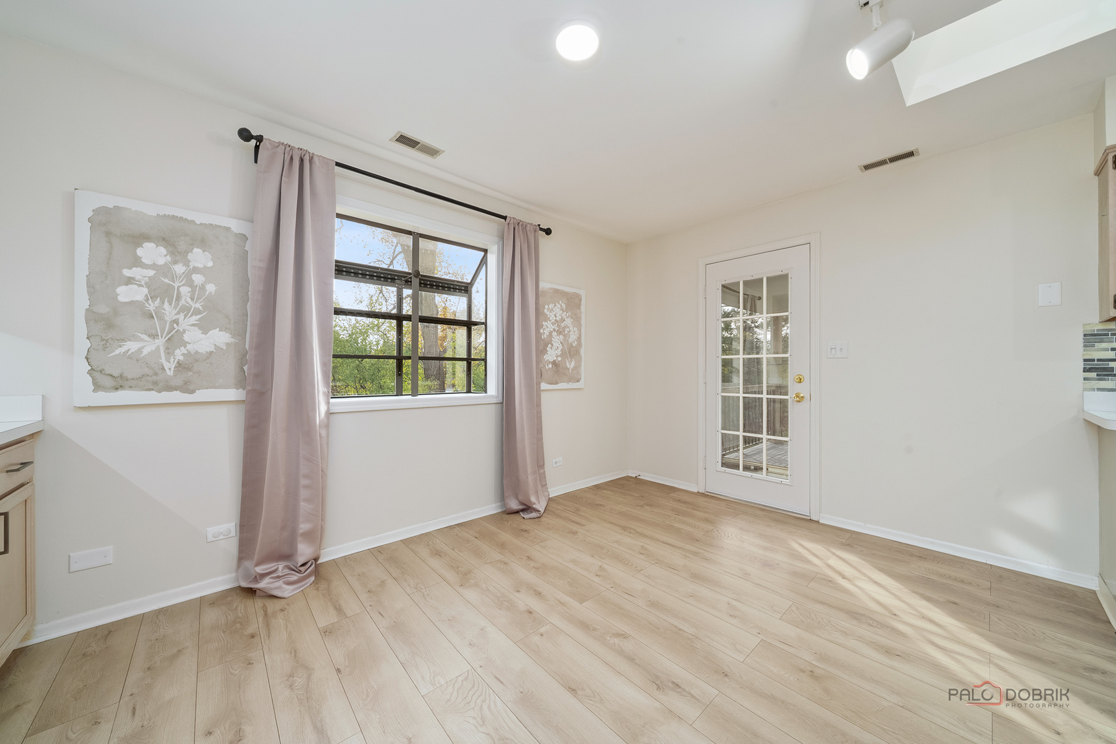 970 Ivy Lane, Unit C Deerfield, IL 60015 - Photo 23 of 36 an empty room with wooden floor and windows