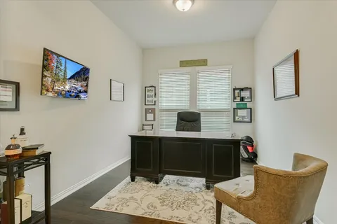 a view of a workspace with furniture