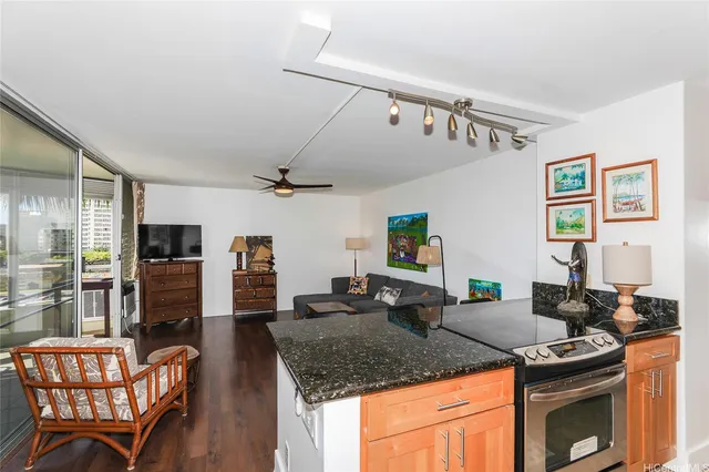 a kitchen with stainless steel appliances granite countertop a stove and a sink