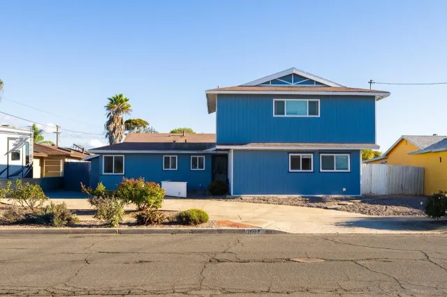 a view of a swimming pool with a yard