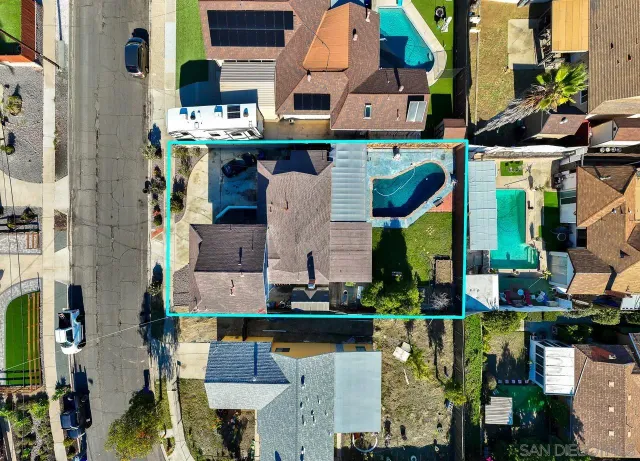 an aerial view of houses with outdoor space