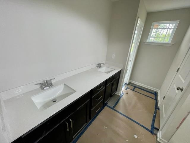 296 Great Pine Trail Middlesex, NC 27557 - Photo 11 of 16 a bathroom with a sink a mirror and a toilet